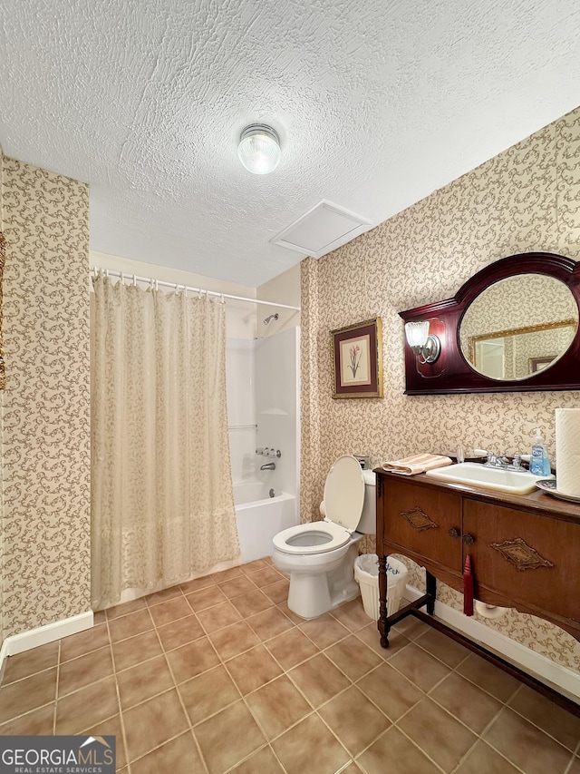 full bathroom featuring tile patterned flooring, toilet, shower / bath combination with curtain, a textured ceiling, and vanity