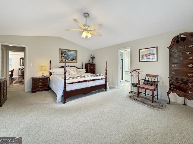 carpeted bedroom with ceiling fan and lofted ceiling