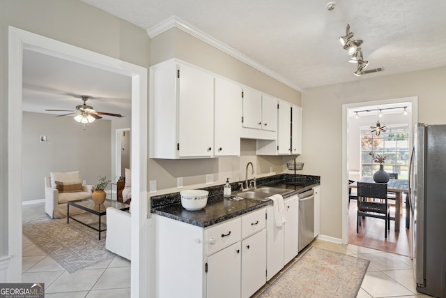 kitchen featuring visible vents, a sink, white cabinetry, appliances with stainless steel finishes, and light tile patterned flooring