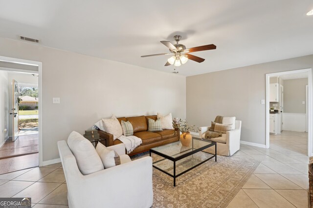 empty room with ceiling fan, hardwood / wood-style floors, and a textured ceiling