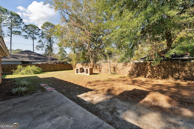 view of yard with a fenced backyard