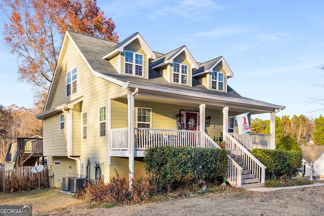 view of front of house featuring a porch and central air condition unit