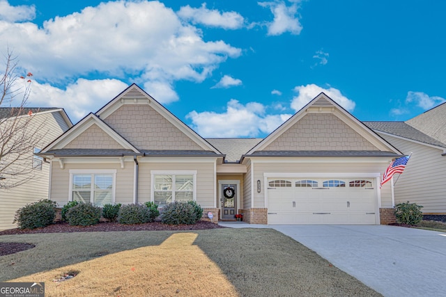 4336 Rockrose Green Way, Gainesville, GA 30504 - craftsman-style house with driveway, a garage, brick siding, and a front lawn