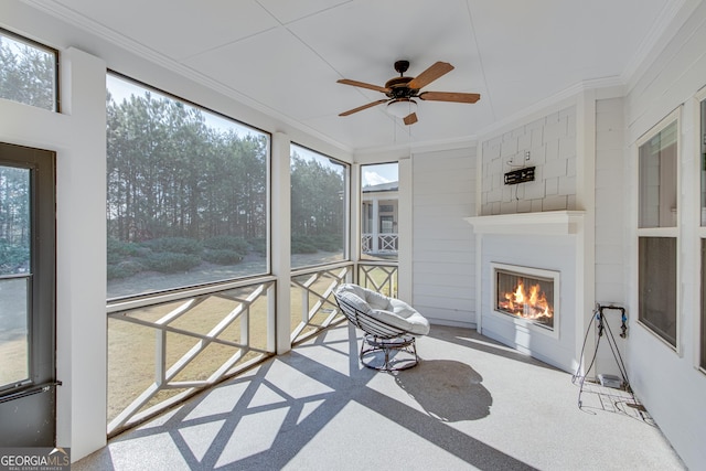 4336 Rockrose Green Way, Gainesville, GA 30504 - sunroom / solarium featuring a lit fireplace and ceiling fan