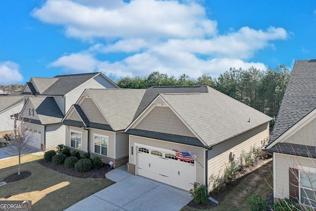 view of front of house featuring a garage and a front lawn