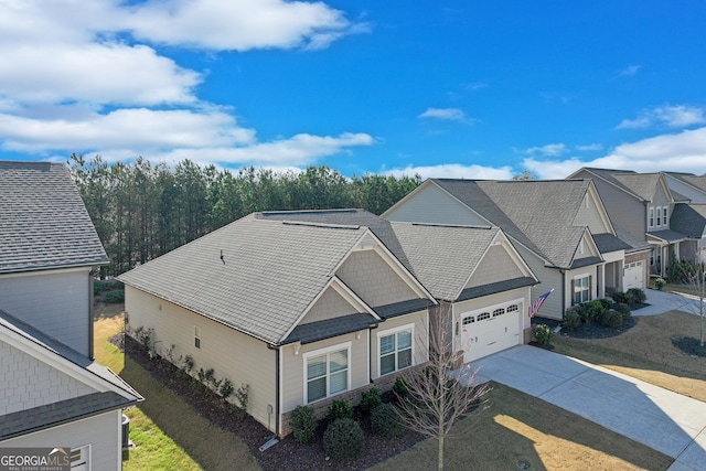 view of front of house with a garage and a front lawn