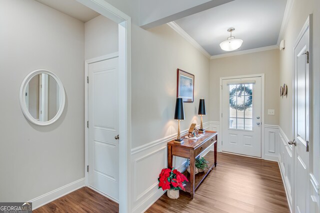 4336 Rockrose Green Way, Gainesville, GA 30504 - foyer with wood finished floors, ornamental molding, a wainscoted wall, and a decorative wall