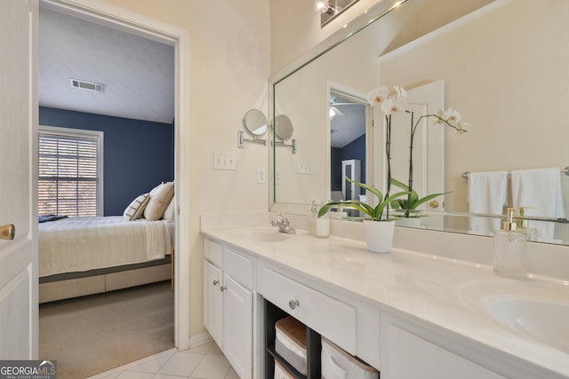 260 Wildcat Lake Dr, Lawrenceville, GA 30043 - ensuite bathroom featuring double vanity and tile patterned floors