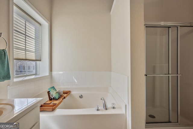 260 Wildcat Lake Dr, Lawrenceville, GA 30043 - full bath featuring vanity, a shower stall, and a garden tub