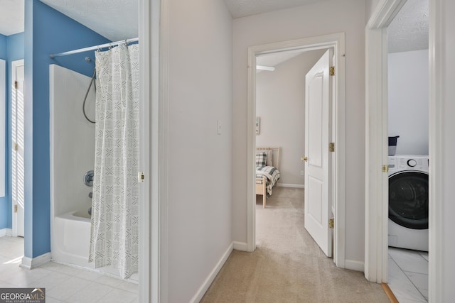 260 Wildcat Lake Dr, Lawrenceville, GA 30043 - full bathroom featuring washer / clothes dryer and shower / bathtub combination with curtain