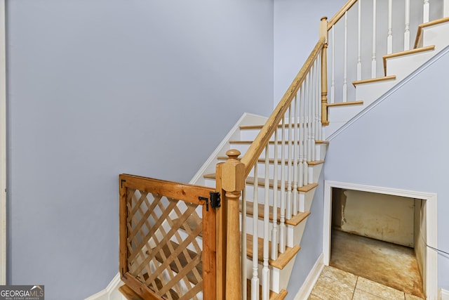 stairs with tile patterned flooring