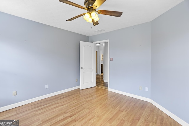 unfurnished room featuring ceiling fan and light hardwood / wood-style floors