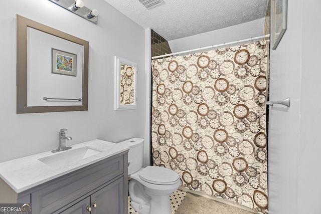 bathroom with a shower with curtain, vanity, a textured ceiling, and toilet