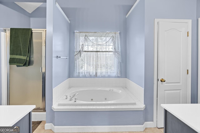 bathroom with vanity and separate shower and tub