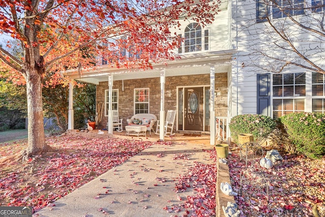 property entrance with covered porch