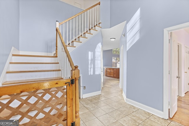 stairs featuring tile patterned floors