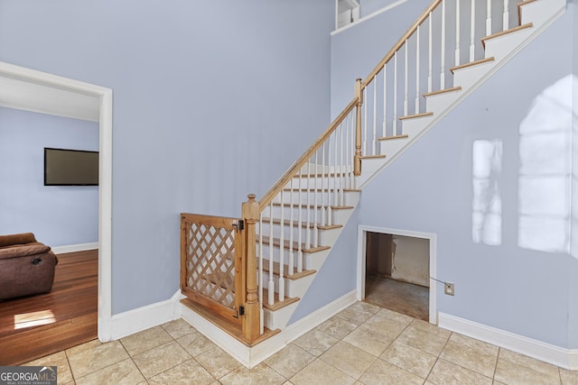 stairs with tile patterned flooring