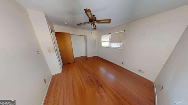 unfurnished bedroom with a closet, ceiling fan, and light hardwood / wood-style flooring