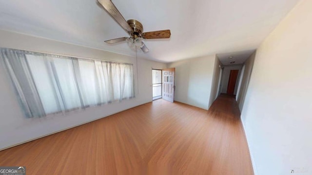 spare room with ceiling fan and light hardwood / wood-style flooring