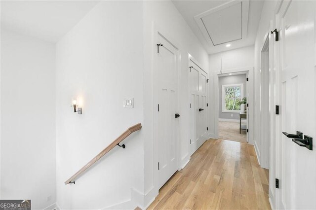 corridor featuring light hardwood / wood-style floors