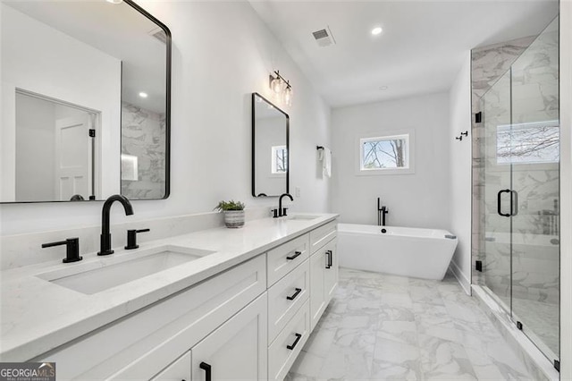 bathroom with vanity and separate shower and tub