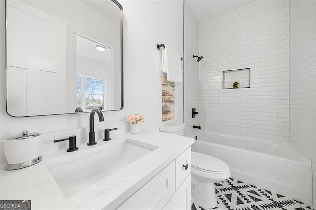 full bathroom with tile patterned floors, vanity, toilet, and tiled shower / bath