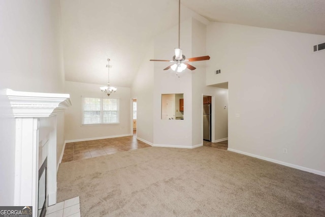 unfurnished living room featuring high vaulted ceiling, light colored carpet, and ceiling fan with notable chandelier