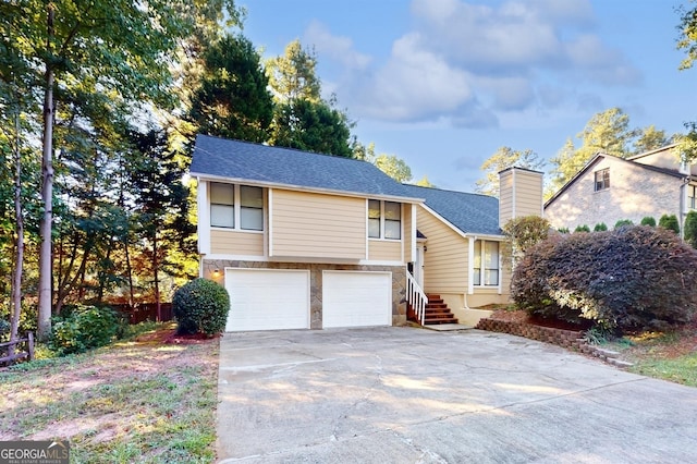 bi-level home featuring a garage