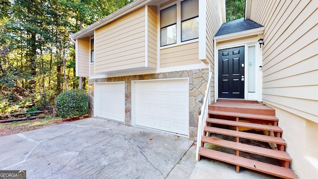 view of exterior entry featuring a garage