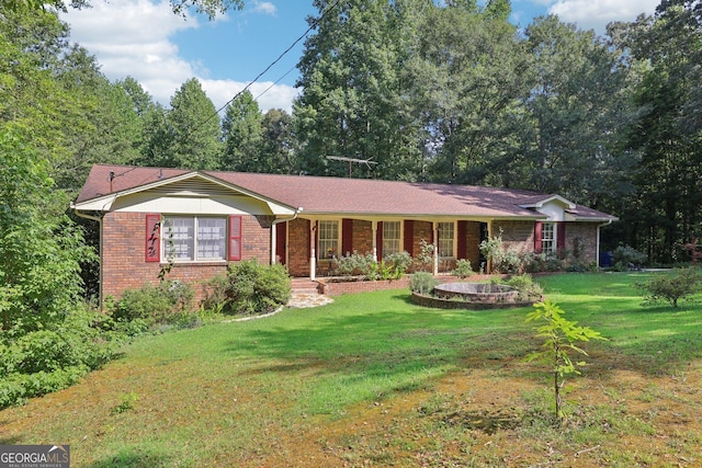 ranch-style home featuring a front yard