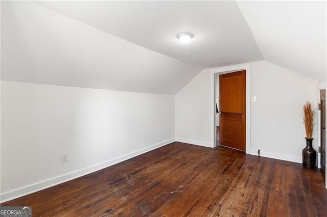 bonus room with dark hardwood / wood-style floors and lofted ceiling