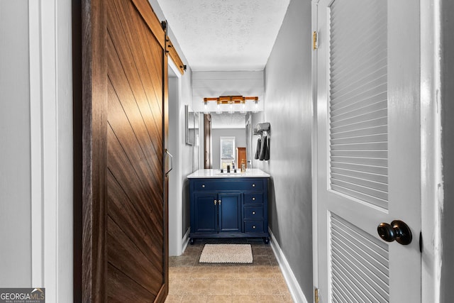 bathroom with vanity and a textured ceiling