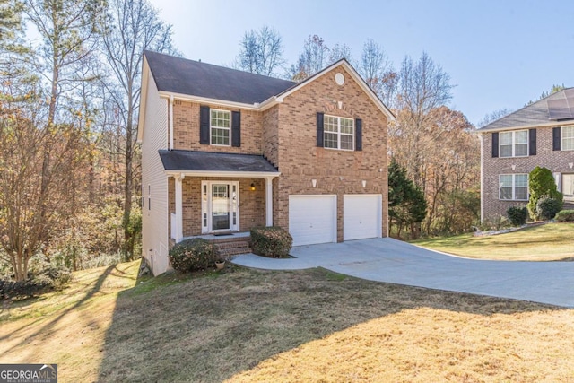 view of property featuring a front lawn and a garage