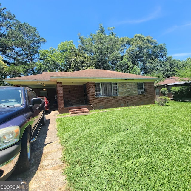 2045 Howe Ave, Columbus, GA 31903 - ranch-style home featuring a carport, a front lawn, and crawl space