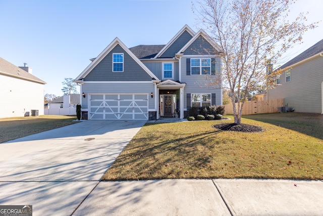 view of front of property with a front yard and a garage