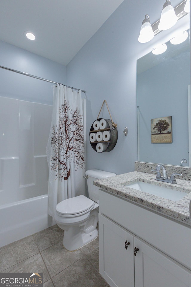 full bathroom with shower / bath combination with curtain, vanity, toilet, and tile patterned floors