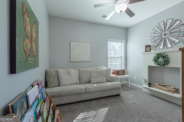 carpeted living room featuring ceiling fan