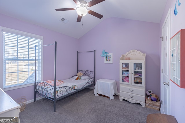 carpeted bedroom with multiple windows, ceiling fan, and lofted ceiling