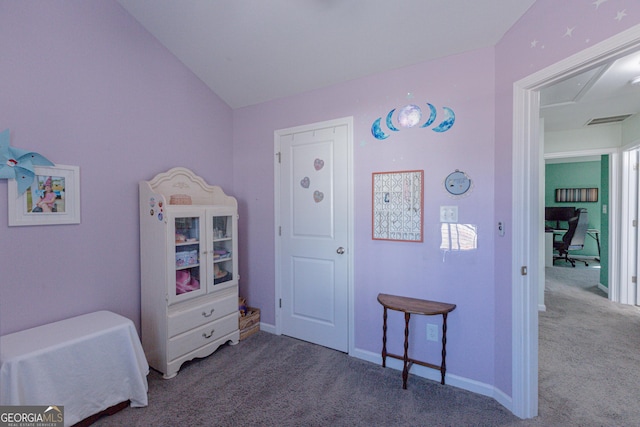 carpeted bedroom with vaulted ceiling