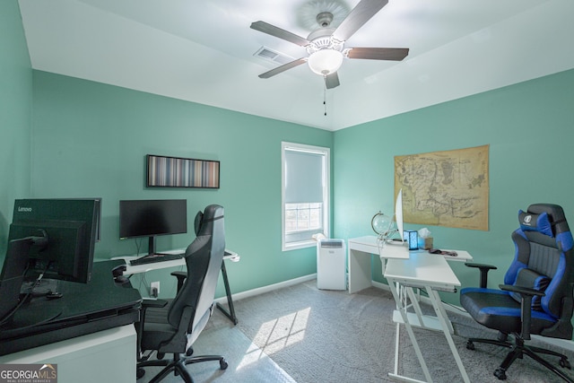 carpeted office with ceiling fan