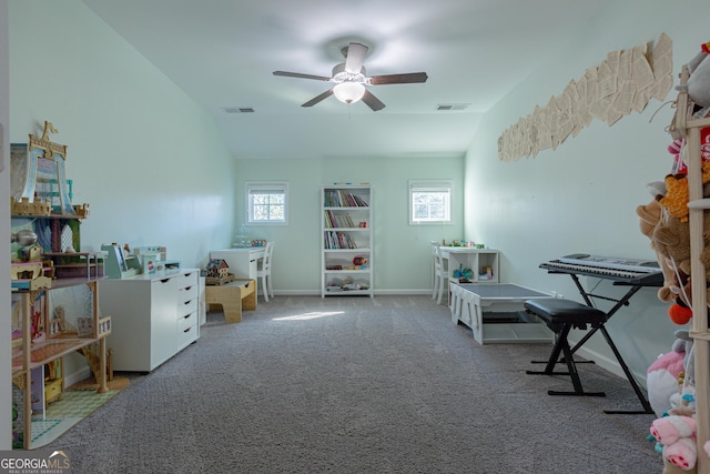 game room with carpet flooring, ceiling fan, and vaulted ceiling