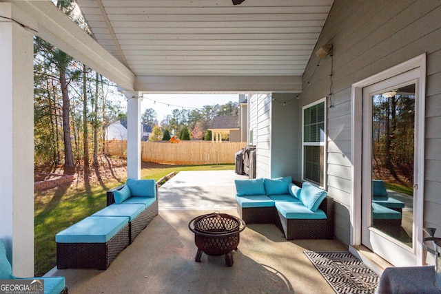 view of patio / terrace featuring an outdoor living space with a fire pit