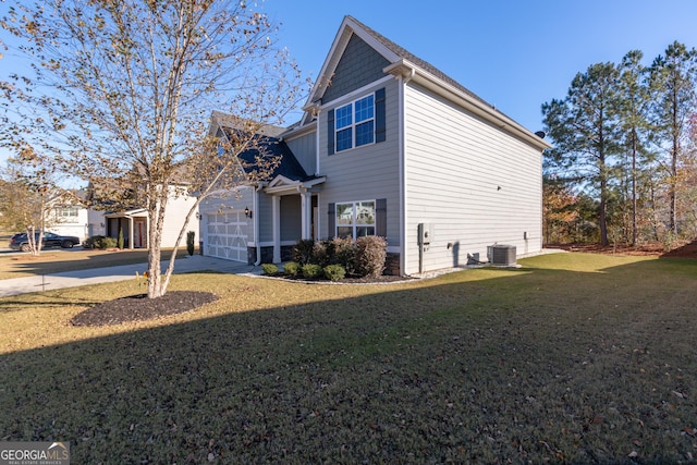 view of property exterior featuring central AC, a yard, and a garage