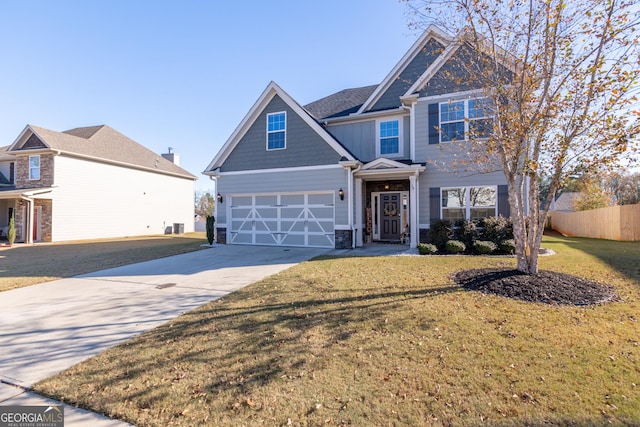 view of front facade with a garage and a front lawn