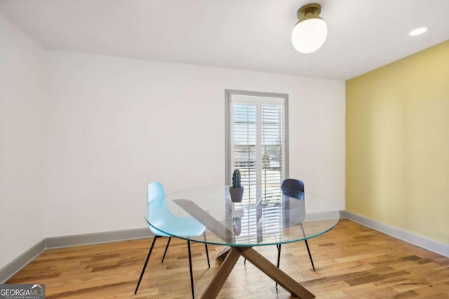 dining space featuring hardwood / wood-style flooring