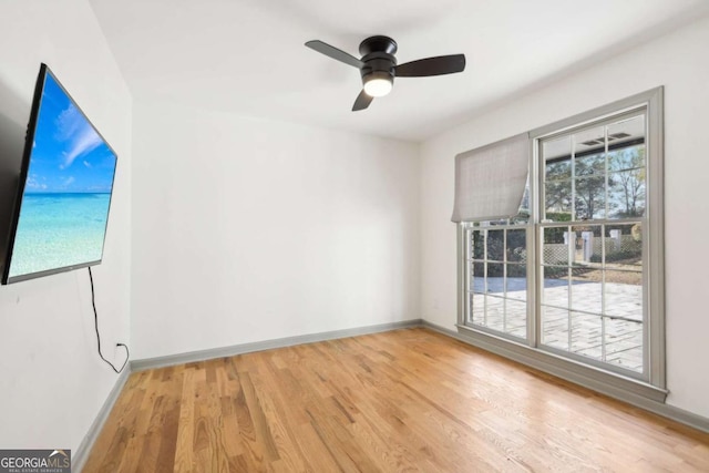 unfurnished room with ceiling fan and light wood-type flooring