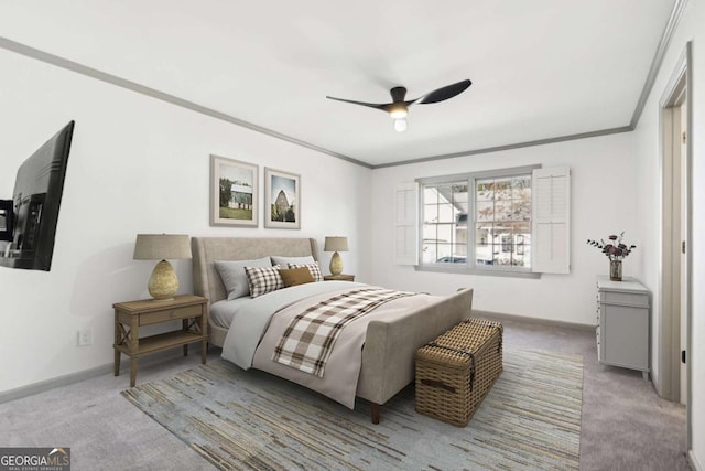 bedroom featuring crown molding, carpet floors, and ceiling fan