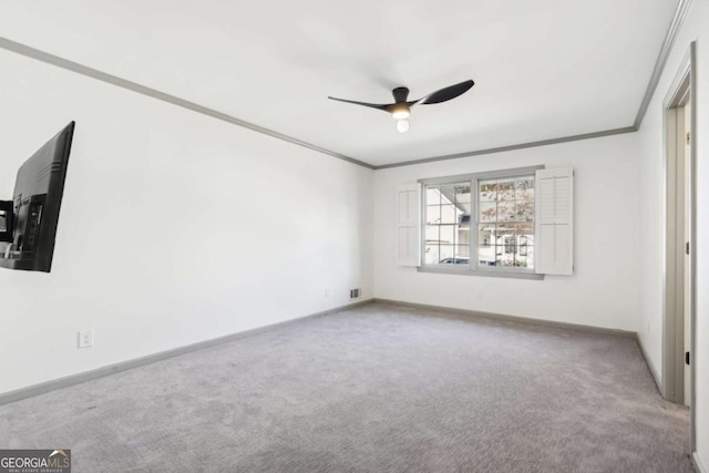 interior space with crown molding, carpet floors, and ceiling fan