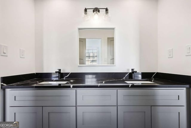 kitchen with gray cabinetry and sink