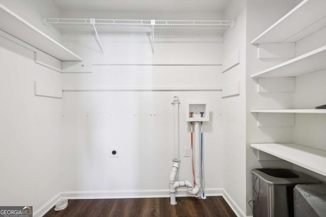 washroom with hookup for an electric dryer, dark hardwood / wood-style floors, and washer hookup